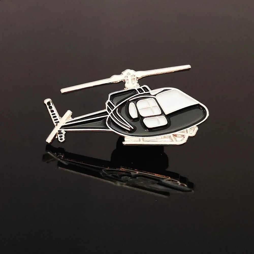 Helicopter aviation design on polished metal badge.