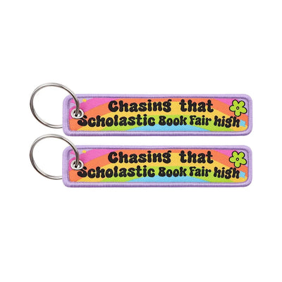Chasing that Scholastic Book Fair high aviation fashion key chain in polished metal.