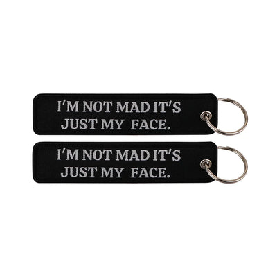 I'M NOT MAD IT'S JUST MY FACE. CHRIST aviation fashion key chain in polished metal.