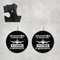 Thumbnail for Side view of Flying is Importanter aviation drop earrings in wood with metal hooks, polished finish.