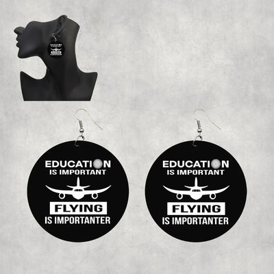 Side view of Flying is Importanter aviation drop earrings in wood with metal hooks, polished finish.