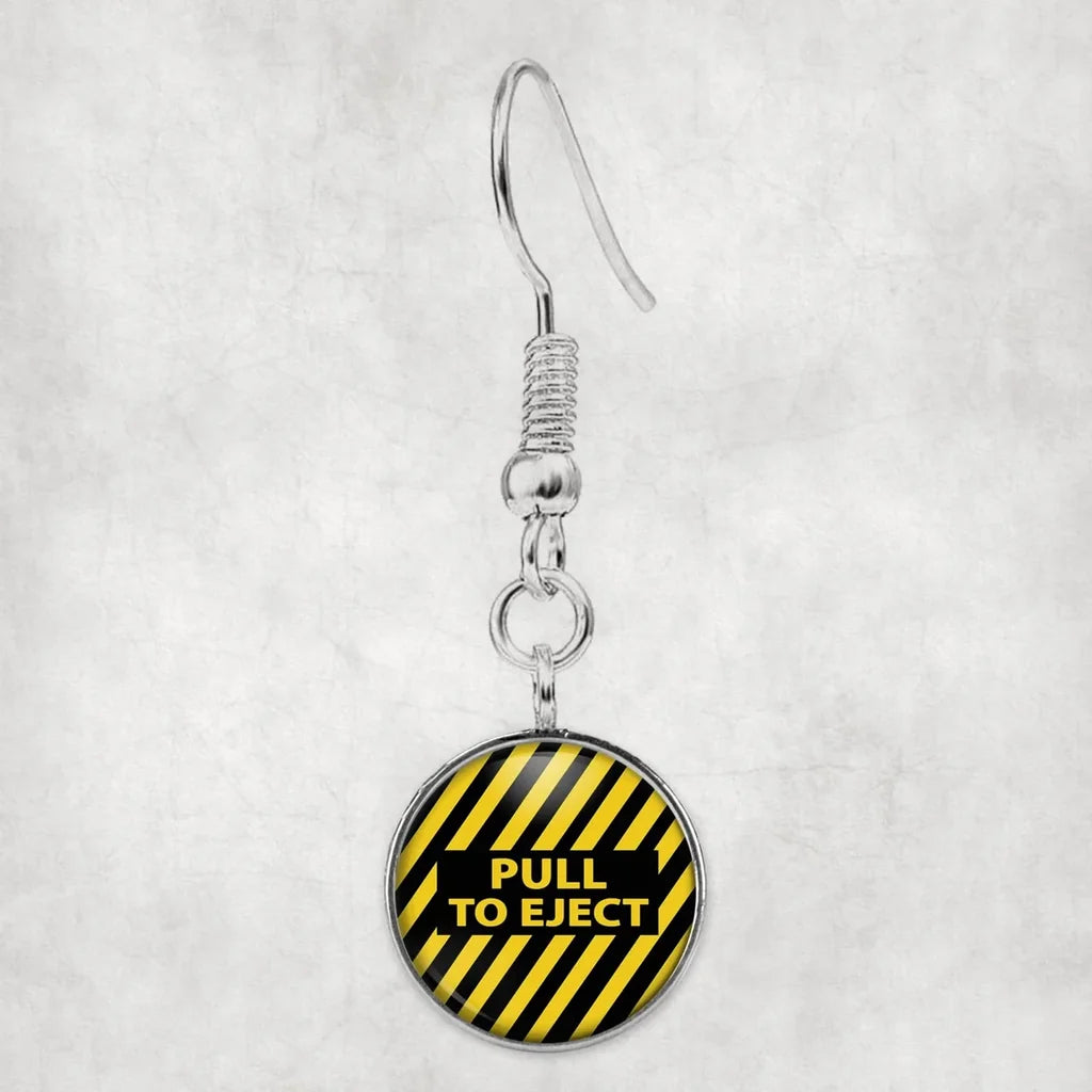 Pull To Eject aviation-themed earrings, polished hypoallergenic alloy.