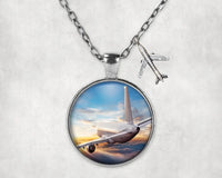 Thumbnail for Airliner Jet Cruising over Clouds aviation-themed necklace, polished stainless steel.