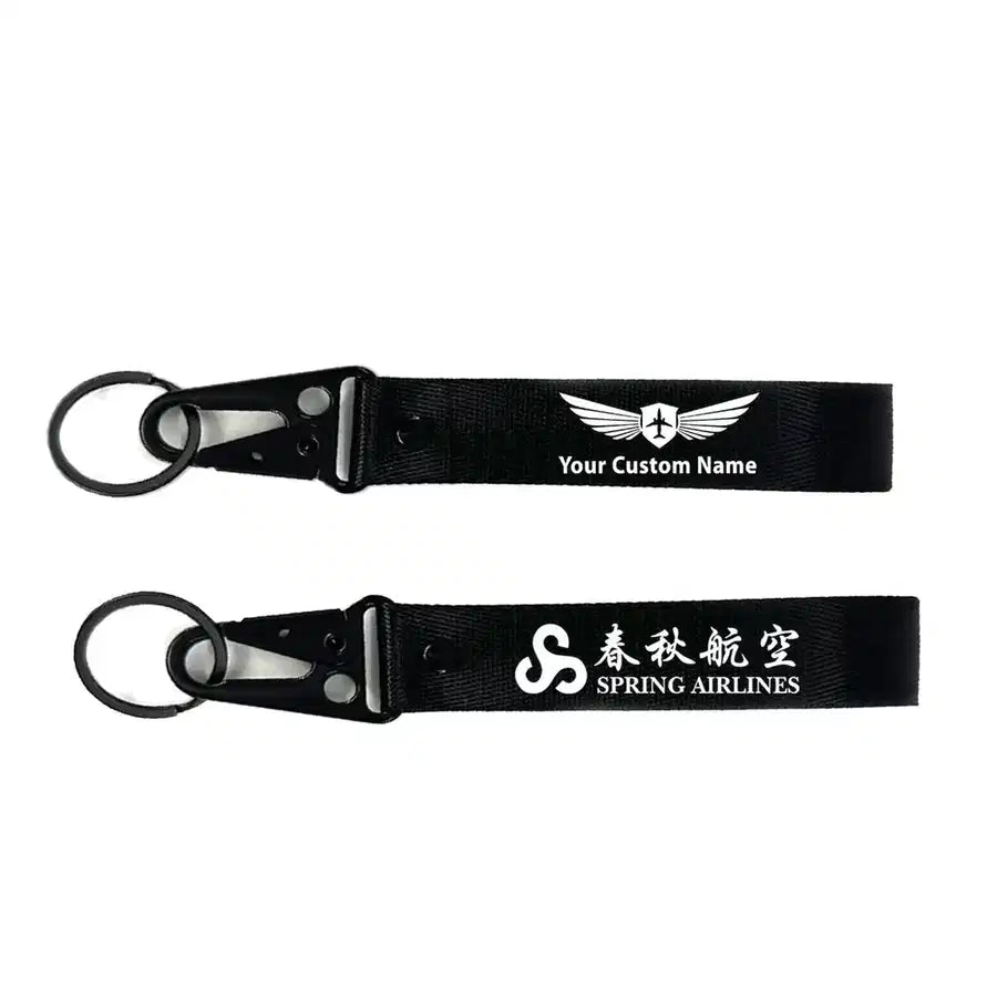 Spring Airlines aviation hawk-shaped key chain, durable metal alloy.