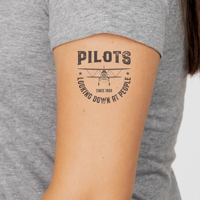 Pilots Looking Down at People Since 1903 aviation temporary tattoo in skin-safe adhesive paper.