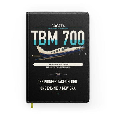 Socata TBM 700 design on black notebook