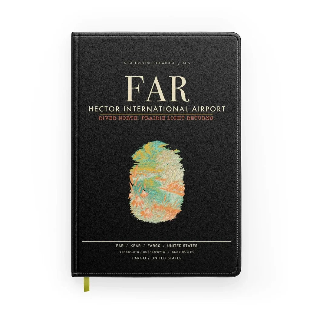 Hector International Airport (FAR) design on black notebook