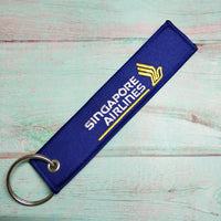 Thumbnail for Singapore Airlines aviation Remove Before Flight key chain, aviation-tag style webbing.
