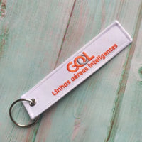 Thumbnail for Gol Linhas Aéreas Inteligentes aviation Remove Before Flight key chain, aviation-tag style webbing.