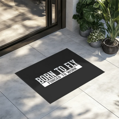 Born To Fly Forced To Work aviation design on durable fibre with non-slip backing door mat.