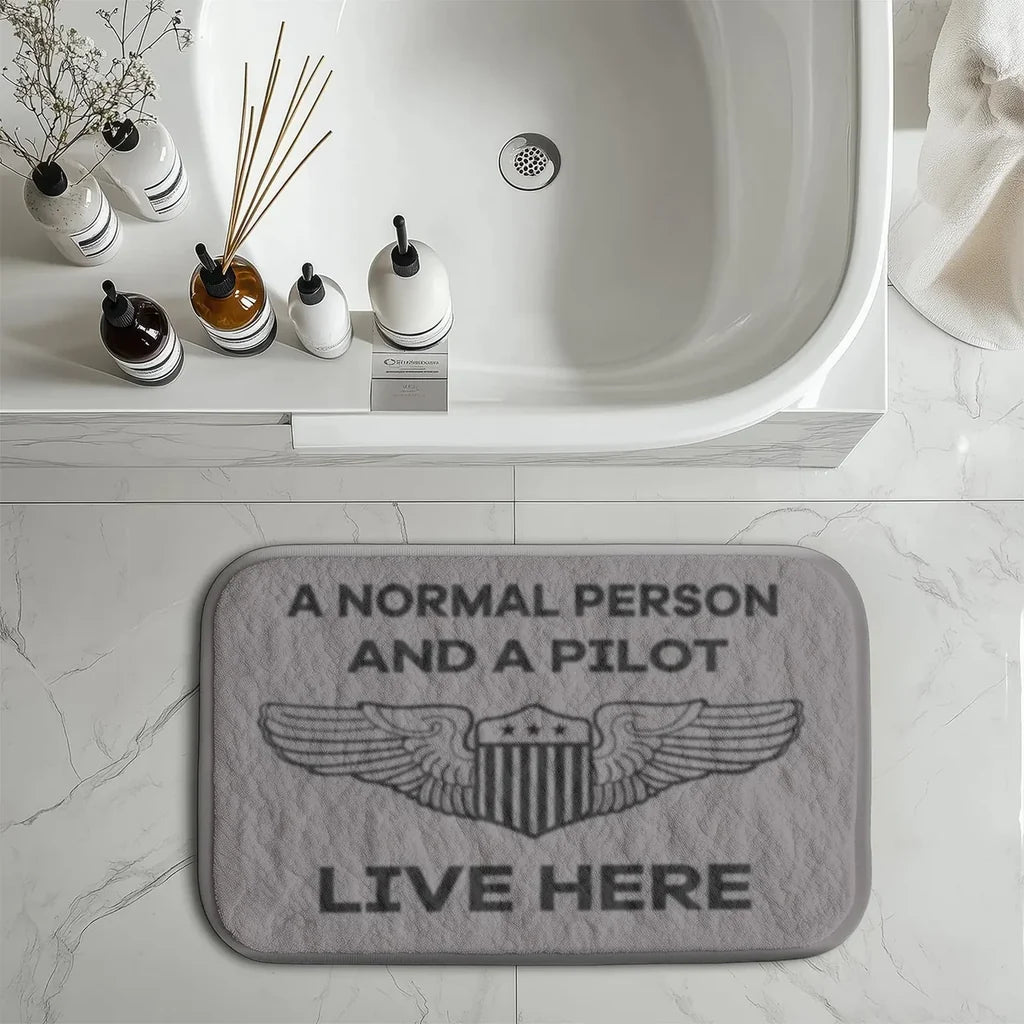 A Normal Person and A PILOT Live Here aviation print bath mat, soft absorbent fabric with non-slip backing.