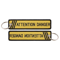 Thumbnail for ATTENTION DANGER aviation fashion key chain in polished metal.