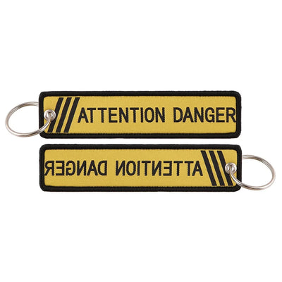 ATTENTION DANGER aviation fashion key chain in polished metal.