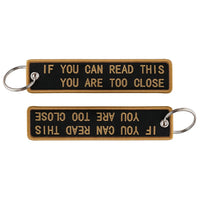 Thumbnail for IF YOU CAN READ THIS YOU ARE TOO CLOSE aviation fashion key chain in polished metal.