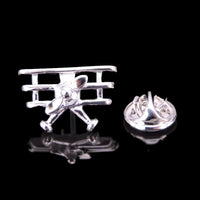 Thumbnail for Simple aviation design on polished metal badge.
