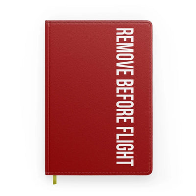 Remove Before Flight 2 aviation design on premium hardcover notebook.