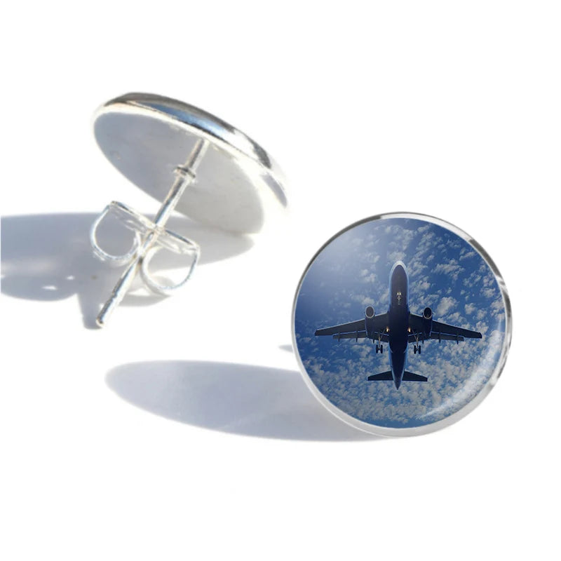 Airplane From Below aviation-themed stud earrings, polished stainless steel.
