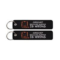 Thumbnail for CROCHET BECAUSE MURDER IS WRONG aviation fashion key chain in polished metal.