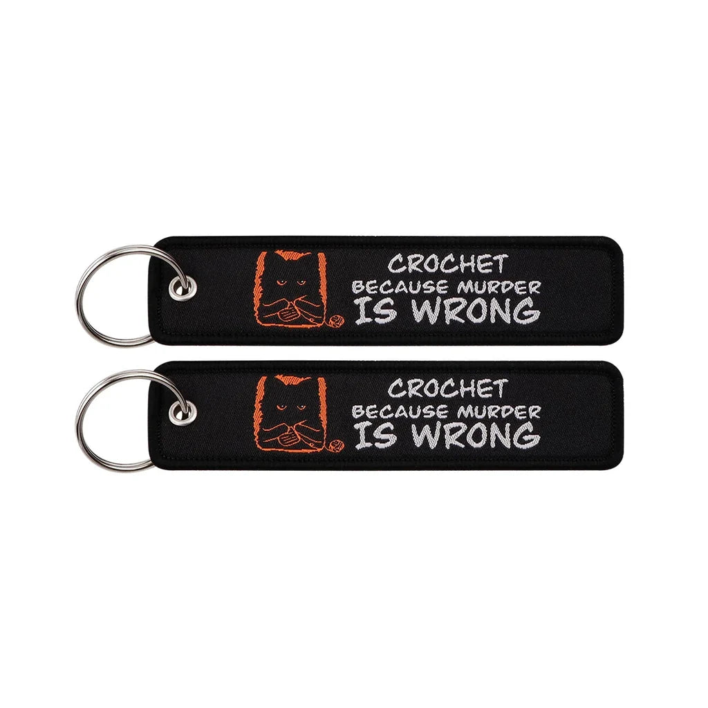 CROCHET BECAUSE MURDER IS WRONG aviation fashion key chain in polished metal.