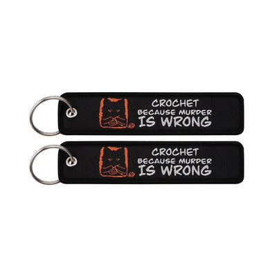 CROCHET BECAUSE MURDER IS WRONG aviation fashion key chain in polished metal.