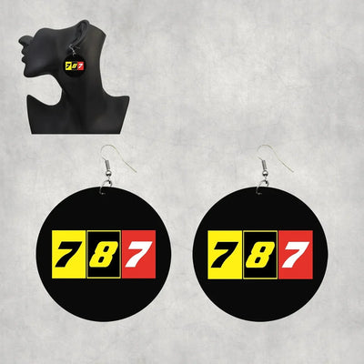 Side view of Flat Colourful 787 aviation drop earrings in wood with metal hooks, polished finish.