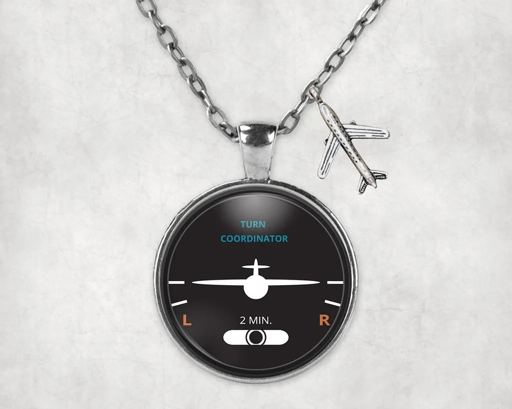 Turn Coordinator aviation-themed necklace, polished stainless steel.