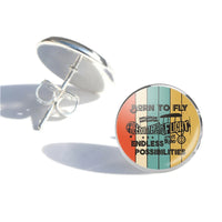 Thumbnail for Colourful Born To Fly aviation stud earrings, stainless steel body with engraved detail.
