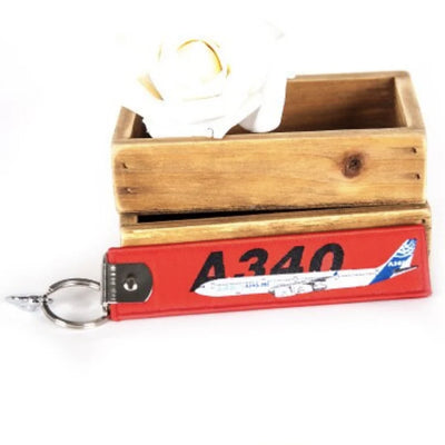 Colourful Airbus A340 aviation Remove Before Flight key chain, aviation-tag style webbing.