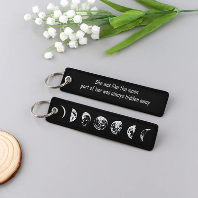 She Was like the Moon Part of Her Was Always Hidden Away aviation fashion key chain in polished metal.