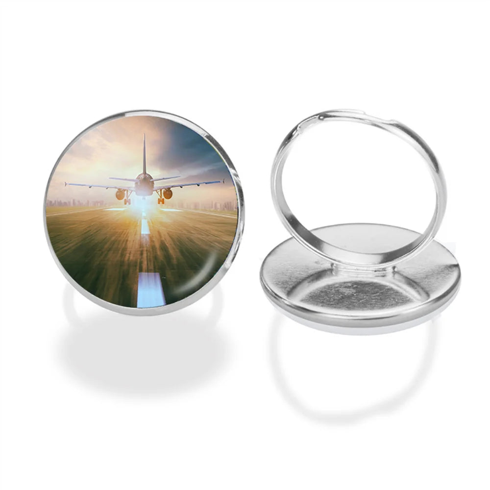 Airplane Flying Over Runway aviation ring in stainless steel.