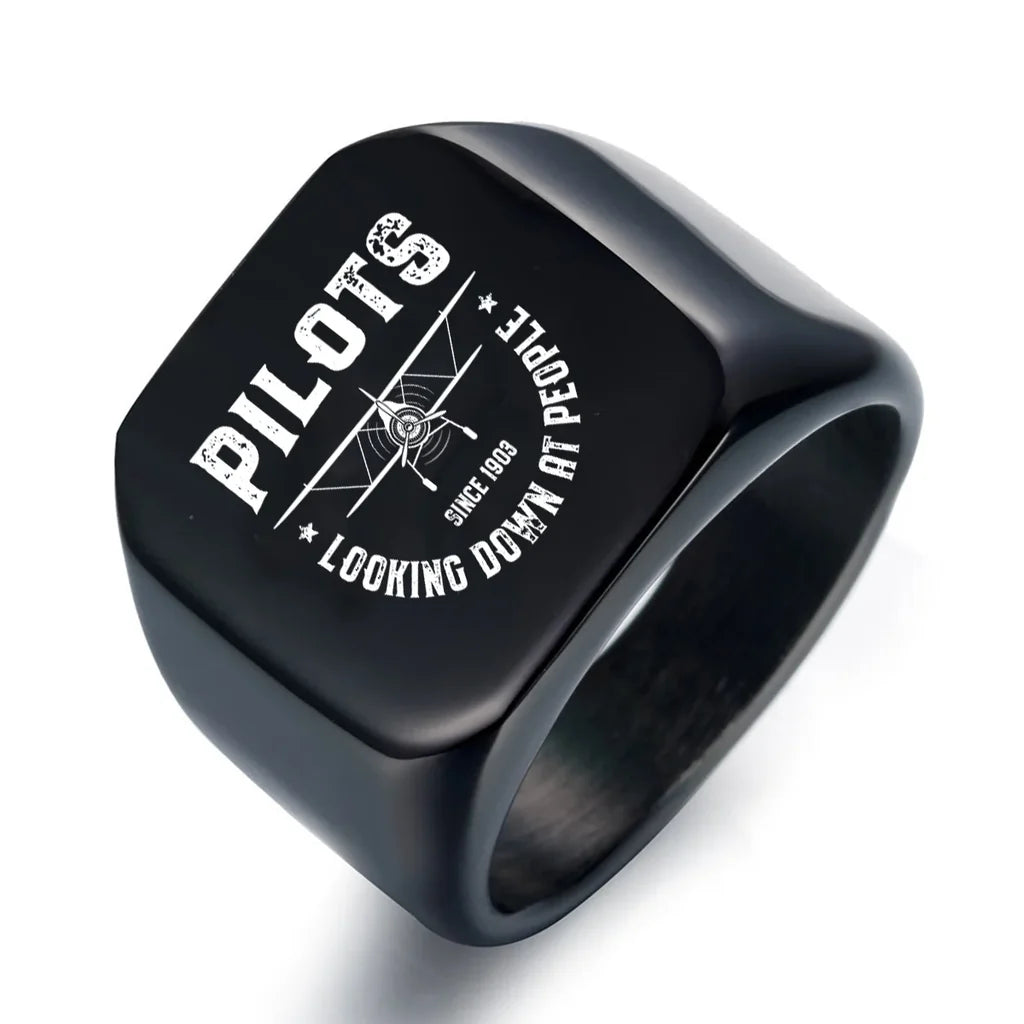 Pilots Looking Down at People Since 1903 aviation ring in stainless steel.