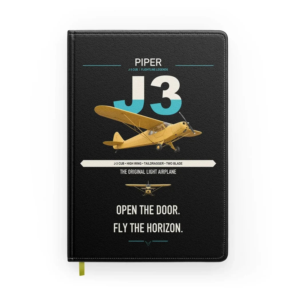 Piper J-3 Cub design on black notebook