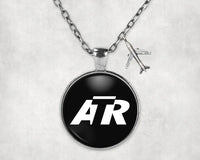 Thumbnail for ATR & Text aviation necklace, stainless steel body with engraved detail.