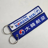 Thumbnail for Korean Airlines aviation Remove Before Flight key chain, aviation-tag style webbing.