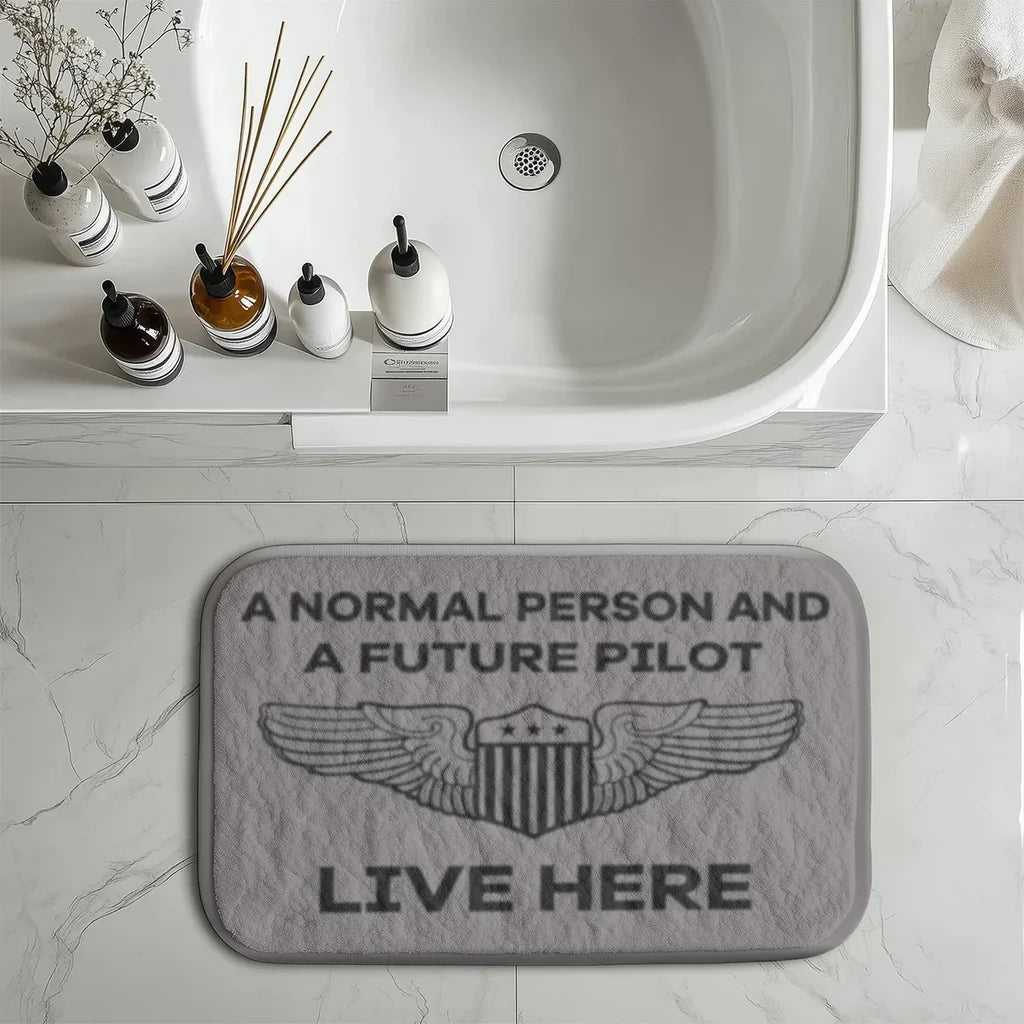 A Normal Person and a FUTURE PILOT Live Here aviation print bath mat, soft absorbent fabric with non-slip backing.