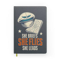 Thumbnail for She Briefs She Flies She Leads design on gray notebook