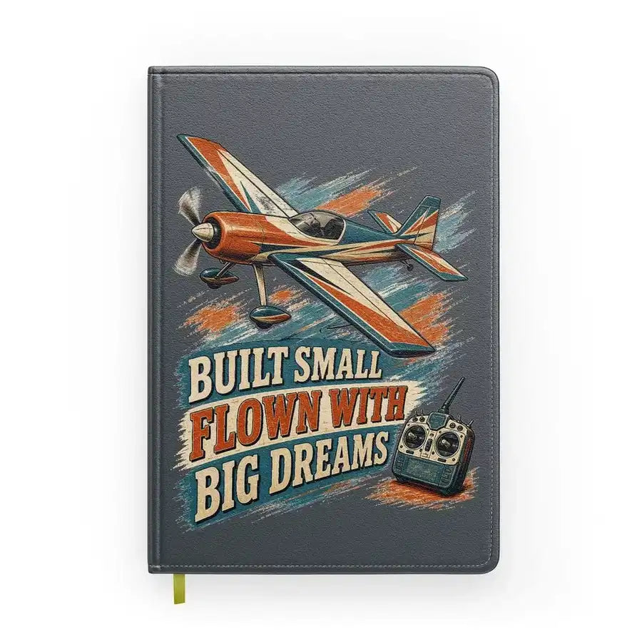 Built Small Flown With Big Dreams design on gray notebook