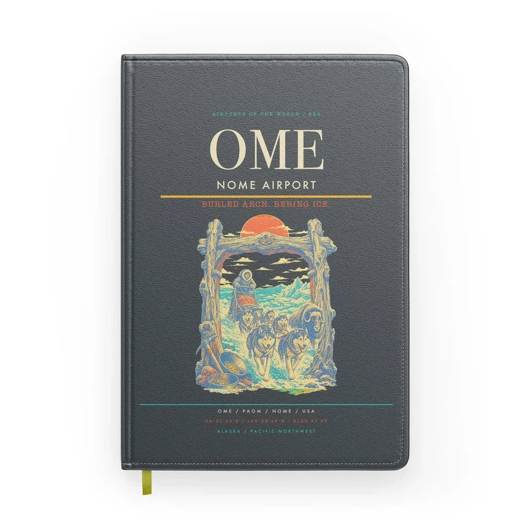 Nome Airport (OME) design on gray notebook