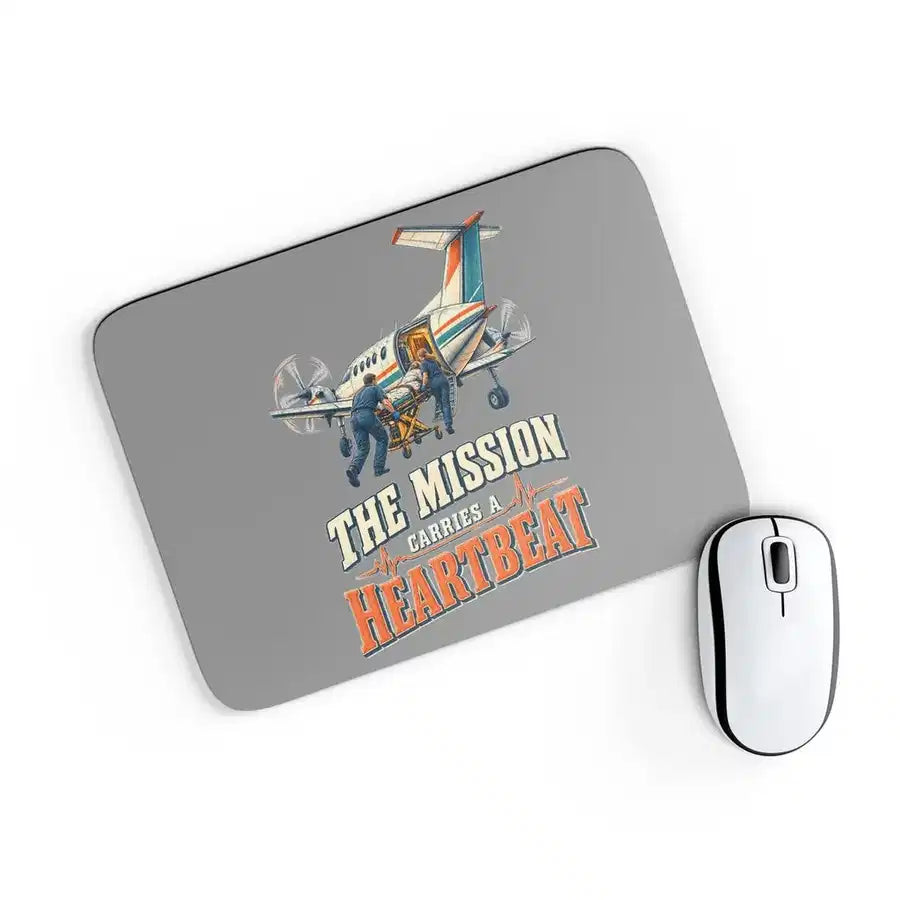 The Mission Carries A Heartbeat design on gray rectangle mouse pad