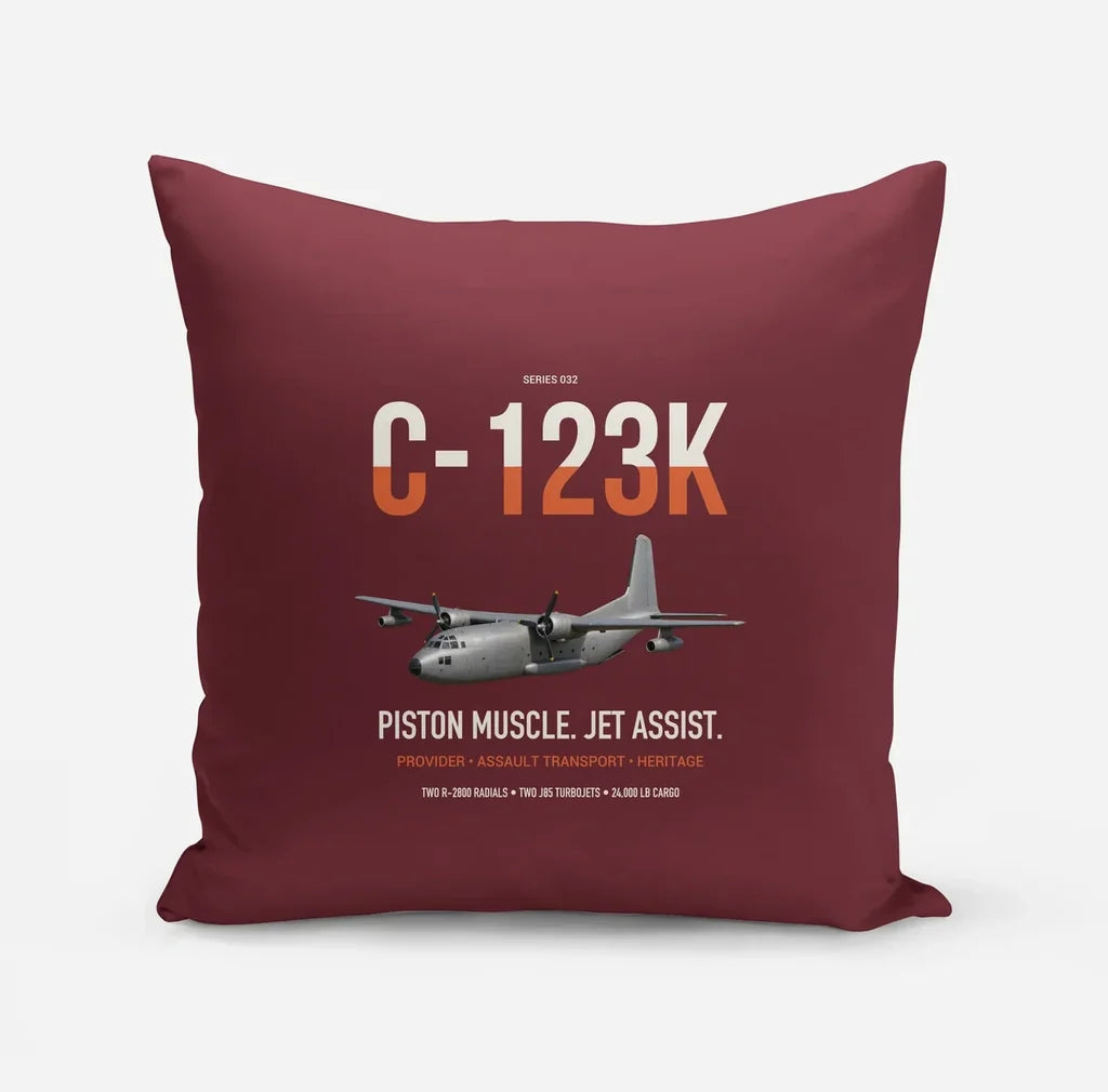 C-123K Provider design on dark red pillow