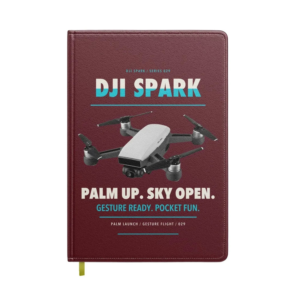 DJI Spark design on dark red notebook