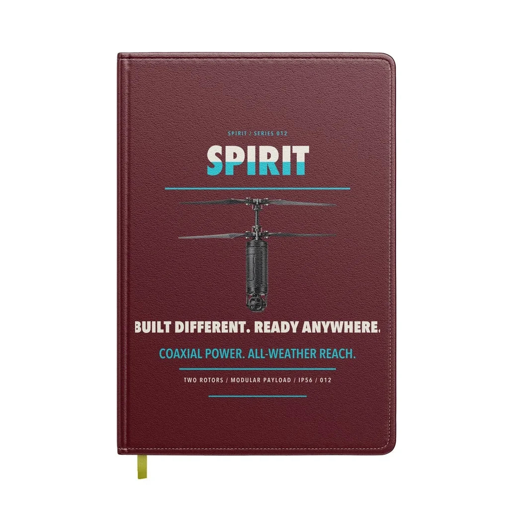 Ascent AeroSystems Spirit design on dark red notebook