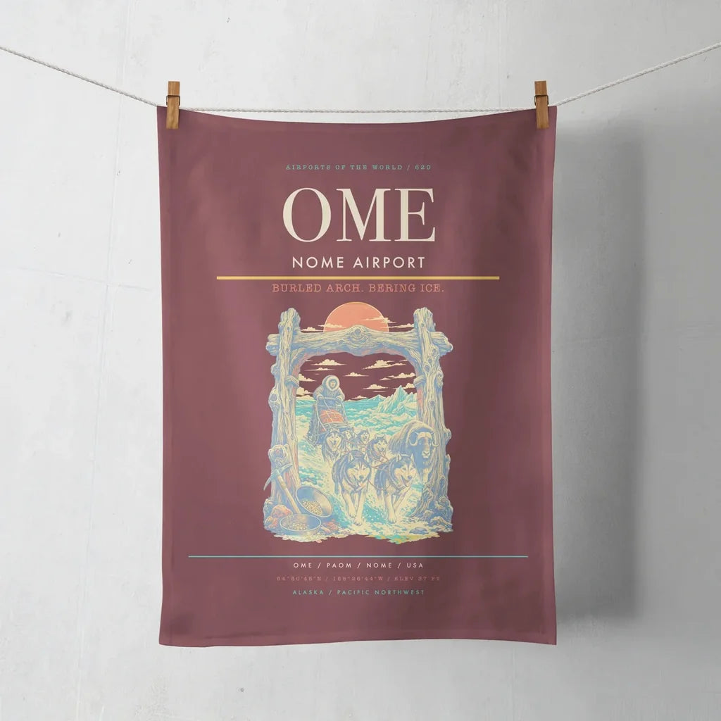 Nome Airport (OME) design on dark red towel