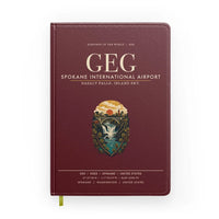 Thumbnail for Spokane International Airport (GEG) design on dark red notebook
