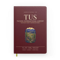Thumbnail for Tucson International Airport (TUS) design on dark red notebook