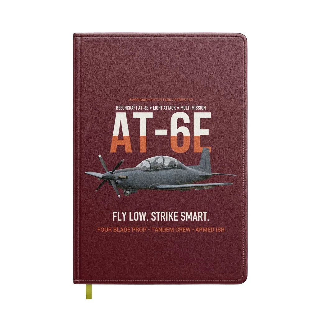 AT-6E Wolverine Light Attack design on dark red notebook