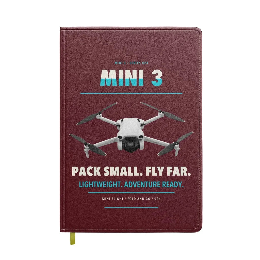 DJI Mini 3 design on dark red notebook