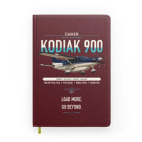Thumbnail for Daher Kodiak 900 design on dark red notebook