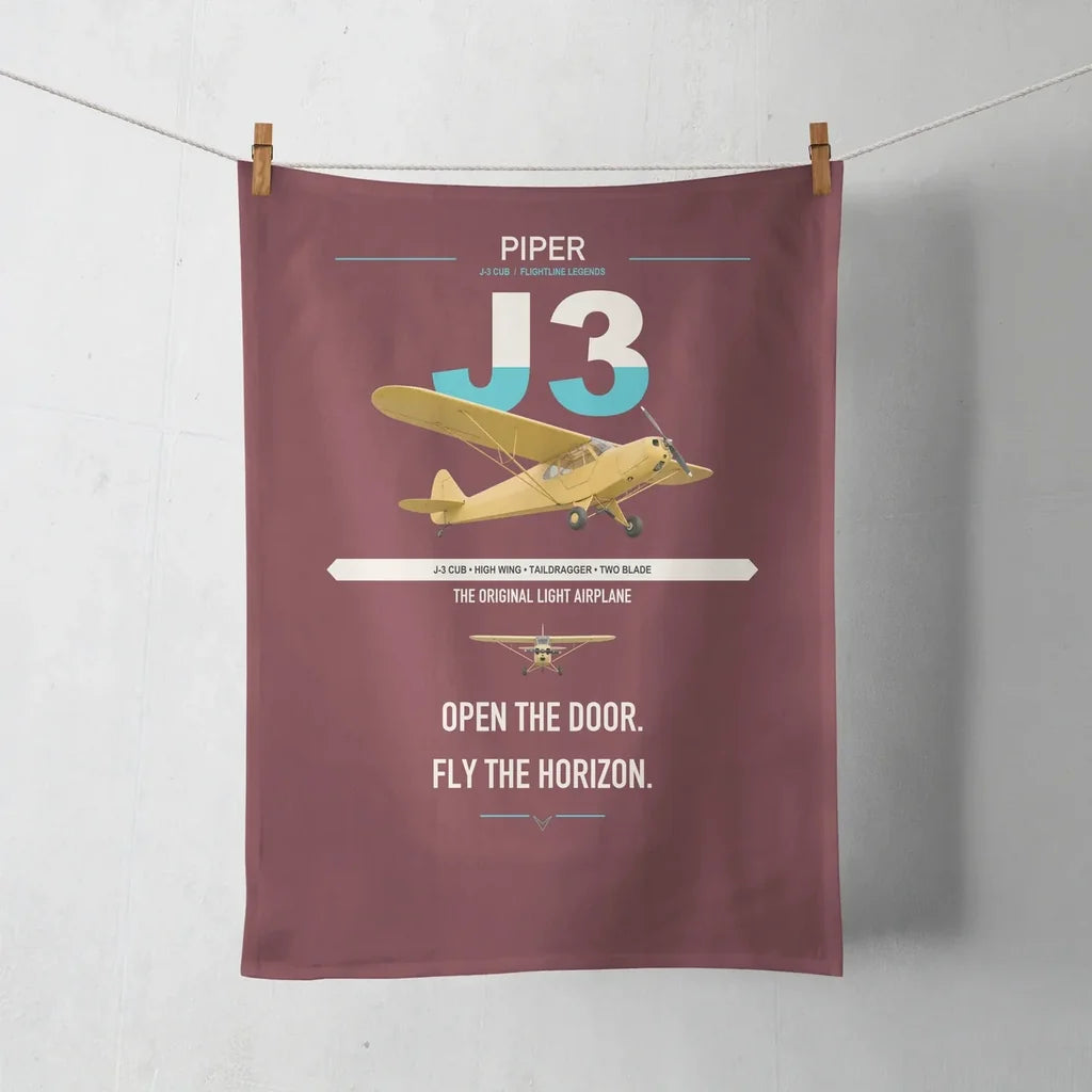 Piper J-3 Cub design on dark red towel