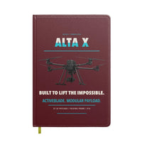 Thumbnail for Freefly Alta X design on dark red notebook